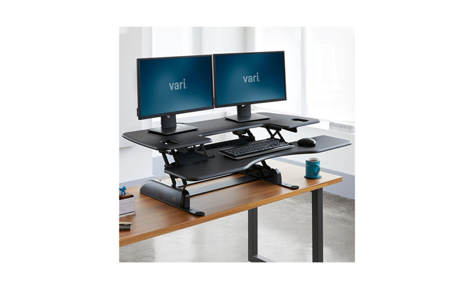 Varidesk Pro Plus 48 in a standing position with two monitors
