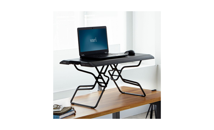 Varidesk SOHO in the standing position on a desk