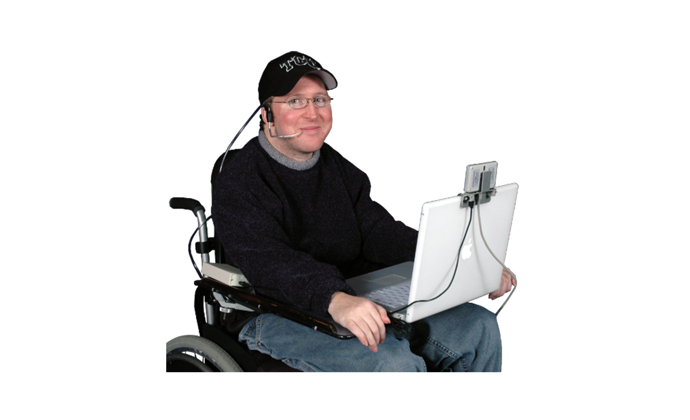 Man in a wheel chair using the Sip Puff Switch with Headset